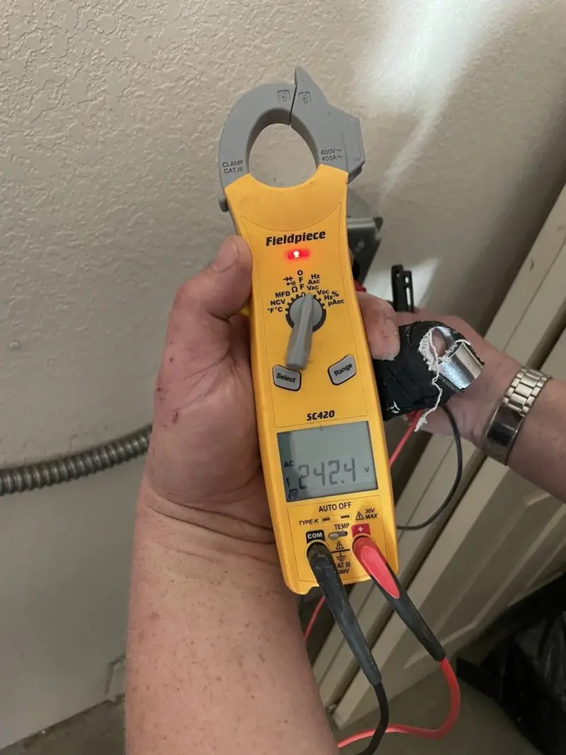 Voltage testing with clamp meter during Whole House Surge Protector in Bellefonte